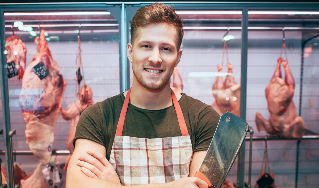 Meat Staff worked in front of meats